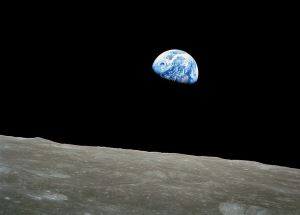 Image shows the Earth rising, seen from the Moon.