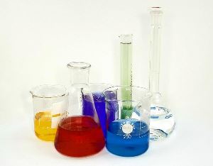 Image shows beakers and test tubes full of coloured liquids.